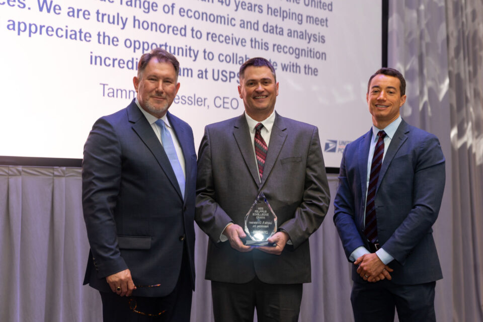 Joe Henningfield (center) receives an award flanked by Mark Guilfoil and Luke Grossman. Photo by Jessica Amerson Photography.